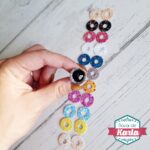 Ojos de seguridad glitter con destellos (mirada lateral o luna)